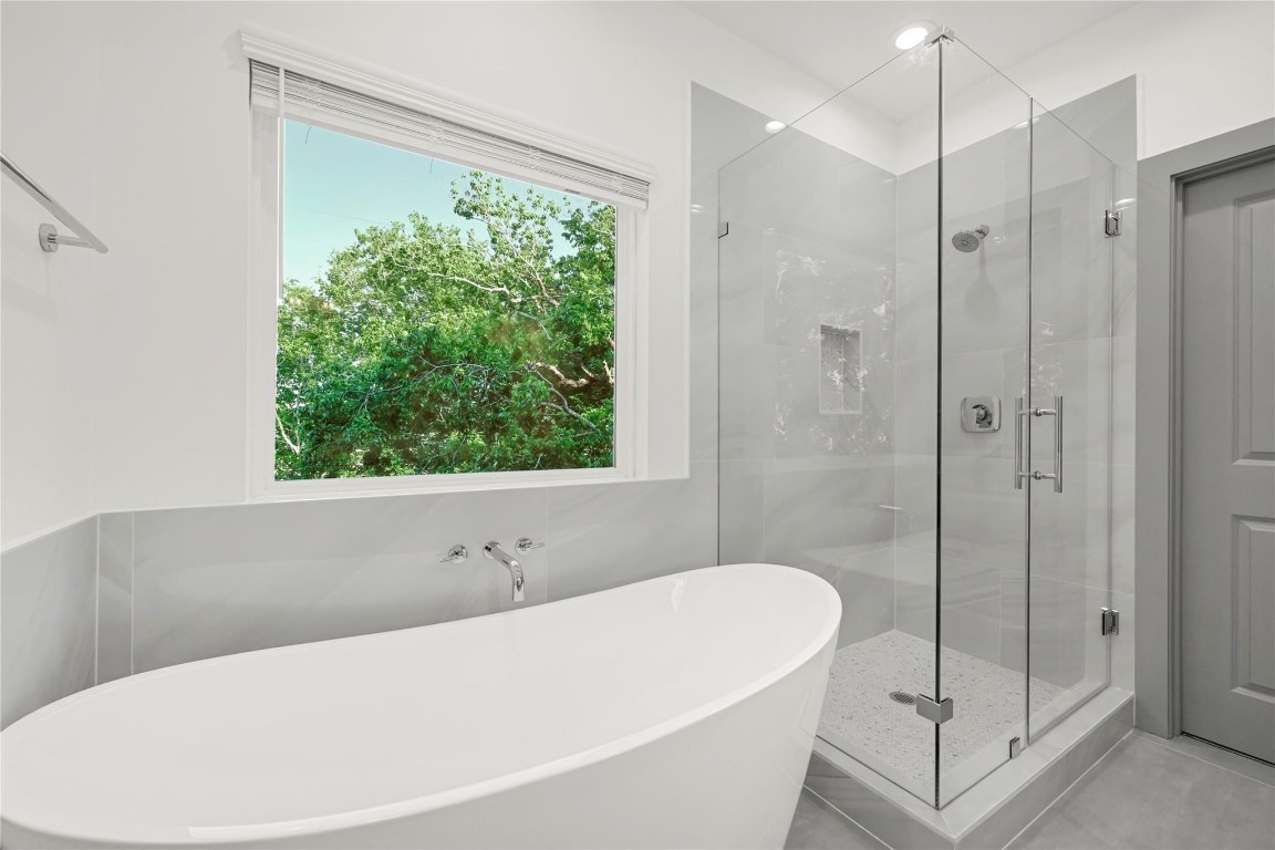 4019 Stassen Street, Unit A Houston, TX 77051 - Photo 25 of 35 a white bath tub sitting next to a shower