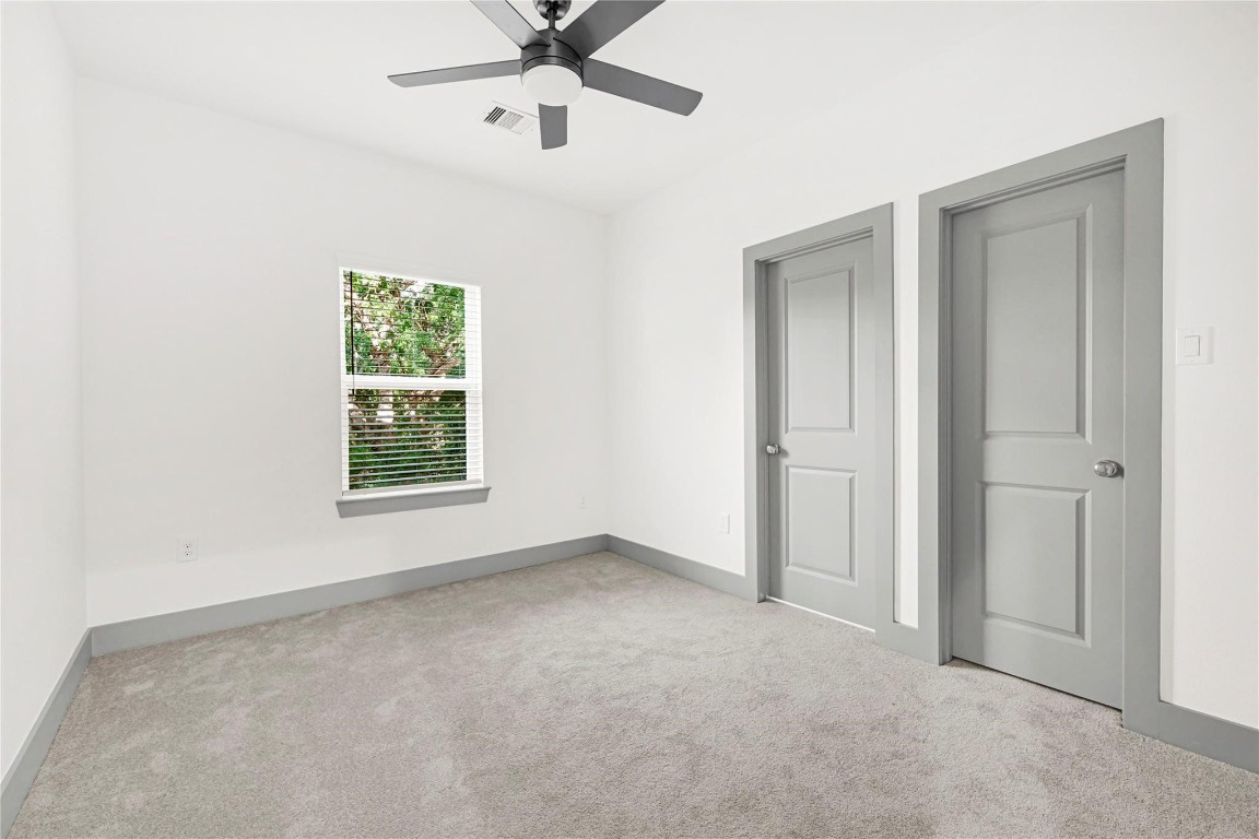 4019 Stassen Street, Unit A Houston, TX 77051 - Photo 28 of 35 an empty room with a window and a fan