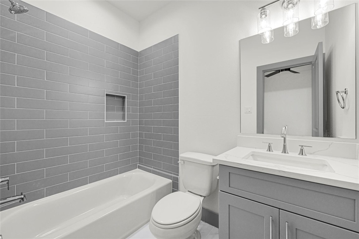 4019 Stassen Street, Unit A Houston, TX 77051 - Photo 29 of 35 a bathroom with a sink a toilet and shower