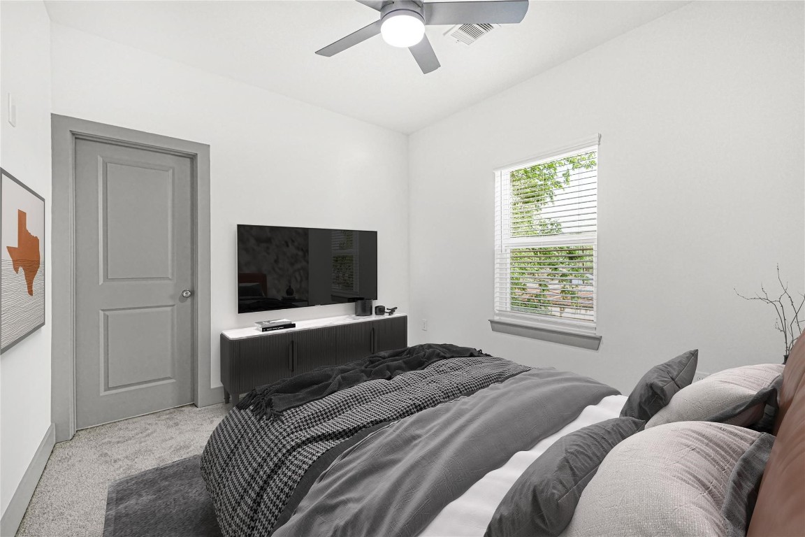 4019 Stassen Street, Unit A Houston, TX 77051 - Photo 30 of 35 a bedroom with a bed and a flat screen tv
