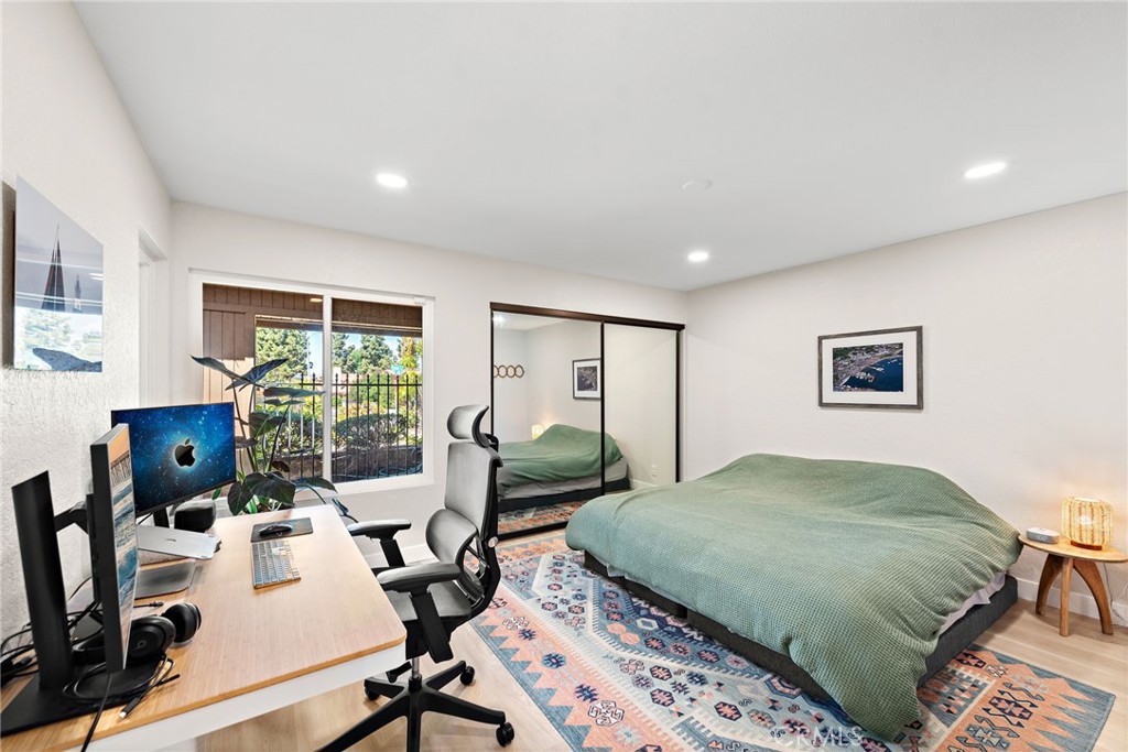 5649 Roane Drive Oceanside, CA 92057 - Photo 16 of 42 a bedroom with a bed and a large window