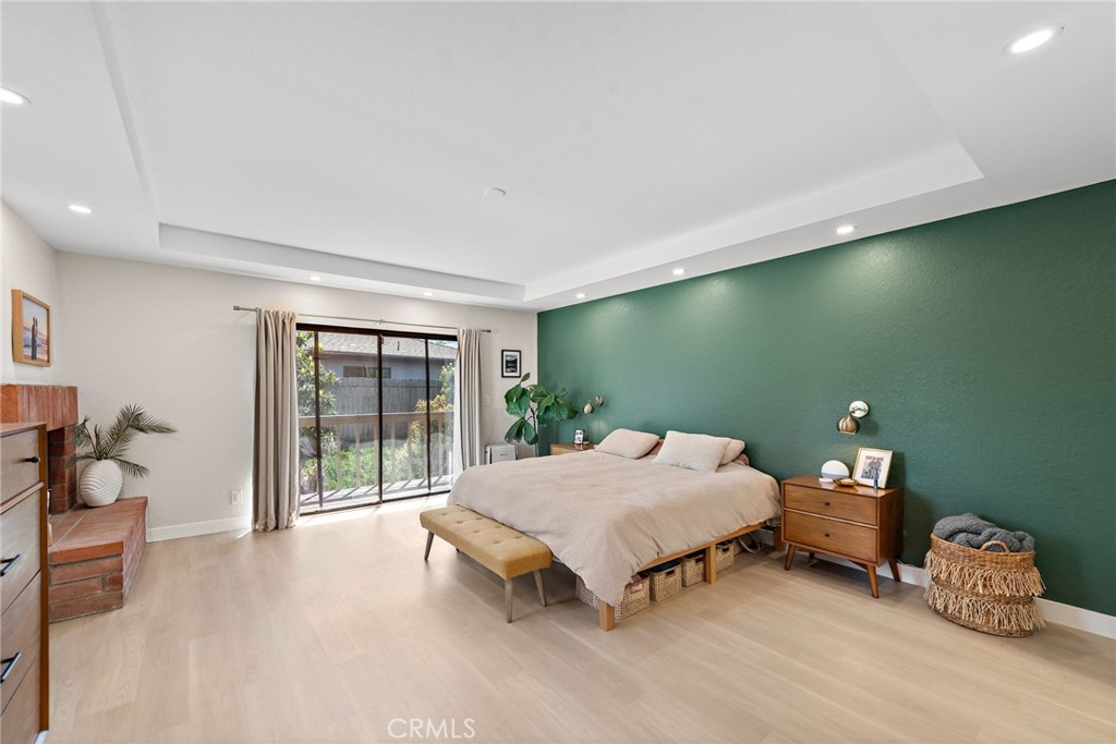 5649 Roane Drive Oceanside, CA 92057 - Photo 17 of 42 a bedroom with a bed and a table