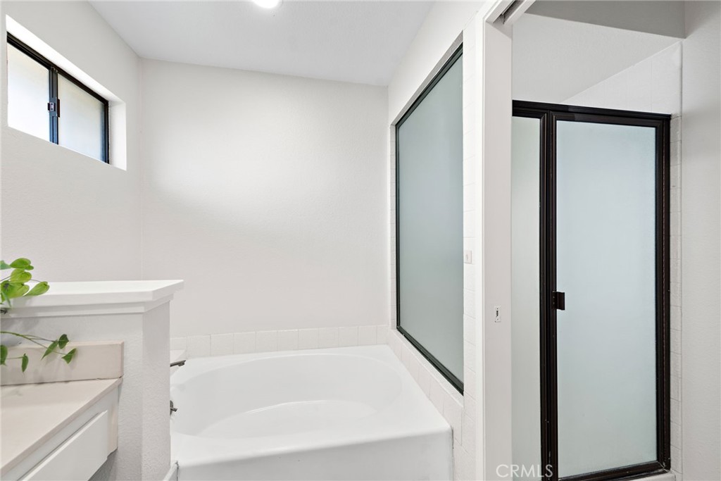 5649 Roane Drive Oceanside, CA 92057 - Photo 20 of 42 a bathroom with a bathtub