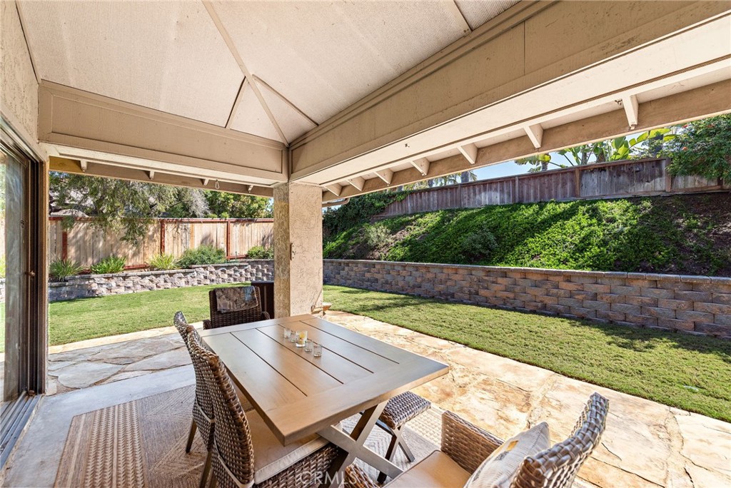 5649 Roane Drive Oceanside, CA 92057 - Photo 25 of 42 a view of an outdoor dining space with a table and chairs