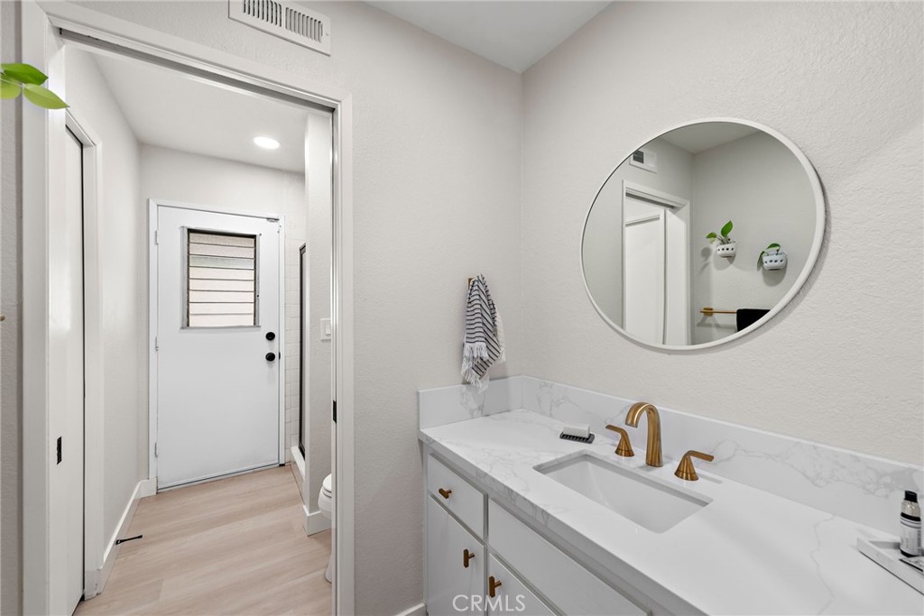 5649 Roane Drive Oceanside, CA 92057 - Photo 4 of 42 a bathroom with a sink and a mirror