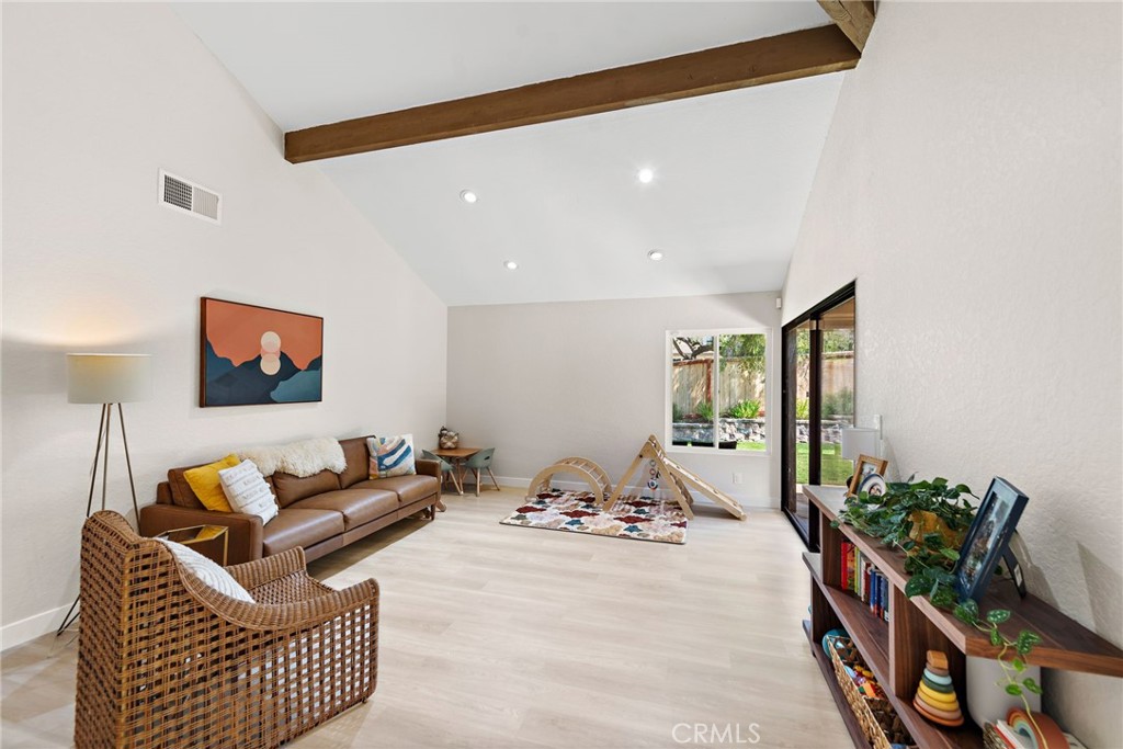 5649 Roane Drive Oceanside, CA 92057 - Photo 8 of 42 a living room with furniture and a flat screen tv