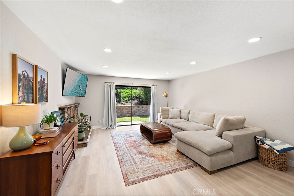 5649 Roane Drive Oceanside, CA 92057 - Photo 9 of 42 a living room with furniture and a flat screen tv