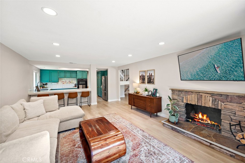 5649 Roane Drive Oceanside, CA 92057 - Photo 10 of 42 a living room with furniture and a fireplace