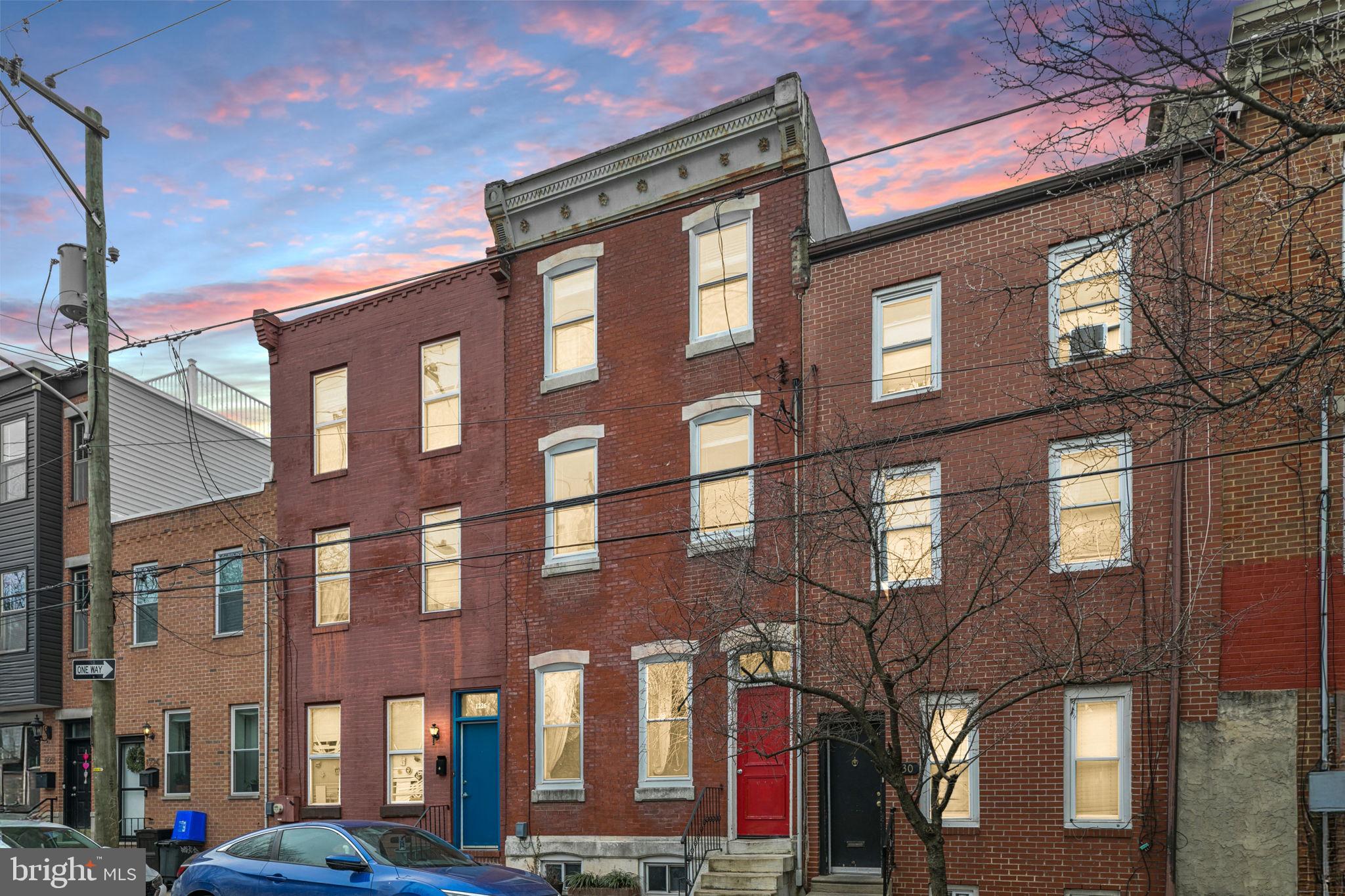 a front view of a brick building with many windows