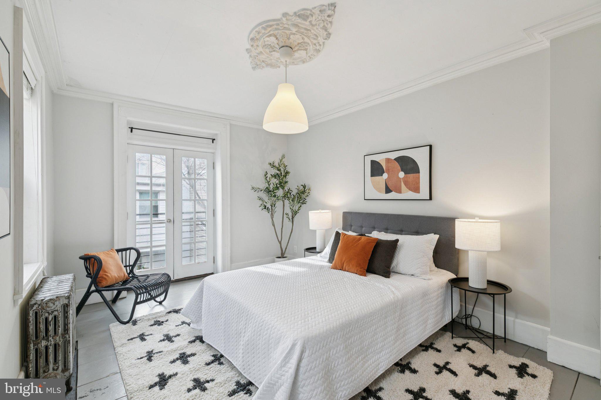 1228 Catharine Street Philadelphia, PA 19147 - Photo 23 of 48 a bedroom with a bed and chair