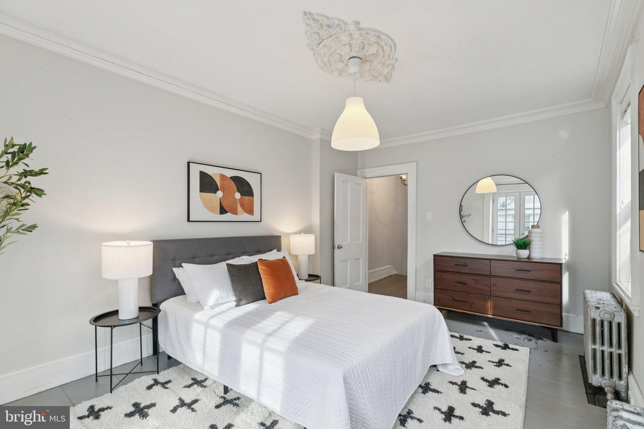 1228 Catharine Street Philadelphia, PA 19147 - Photo 24 of 48 a bedroom with a bed and a dresser