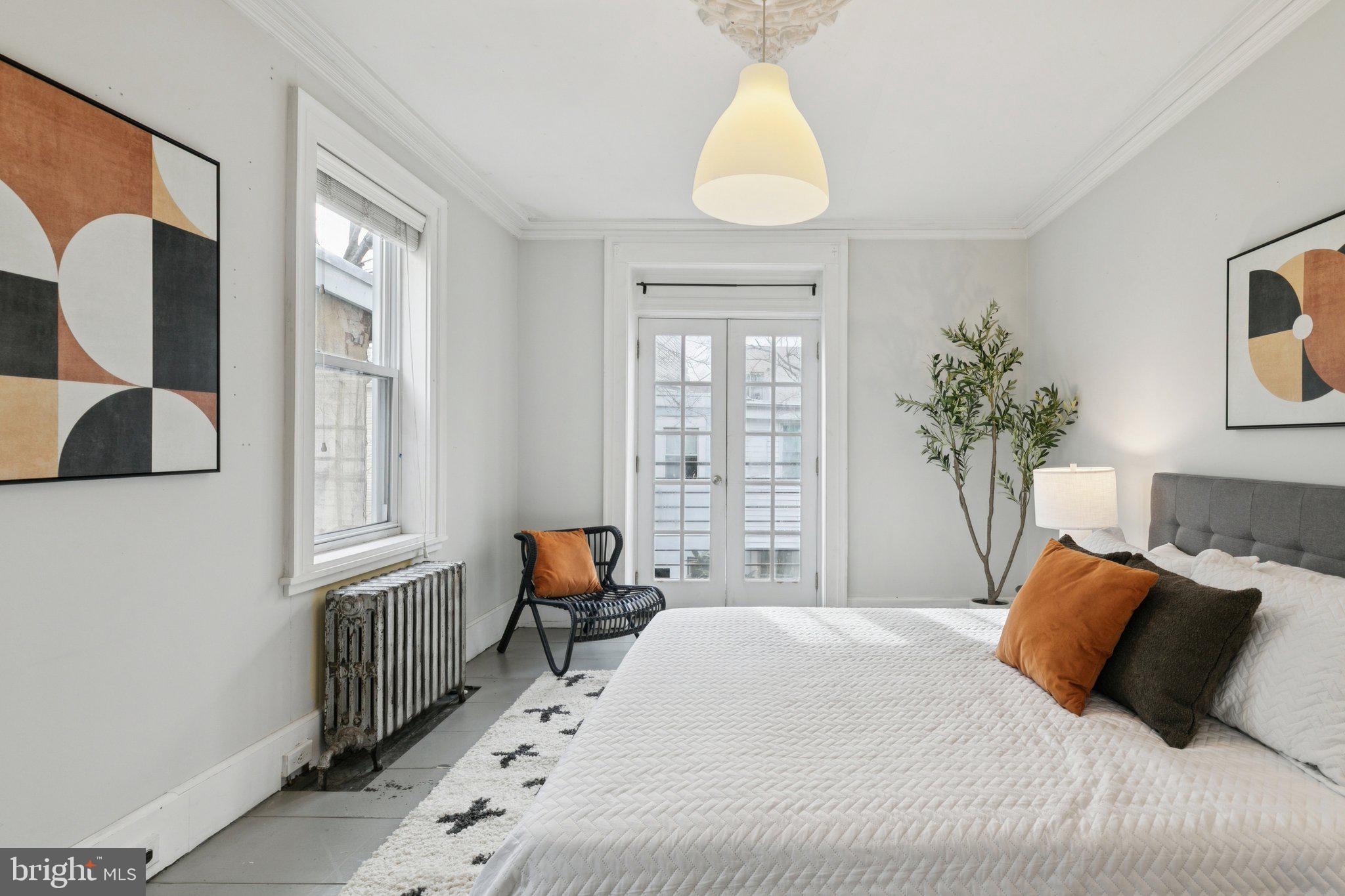 1228 Catharine Street Philadelphia, PA 19147 - Photo 25 of 48 a bedroom with a large bed and a window