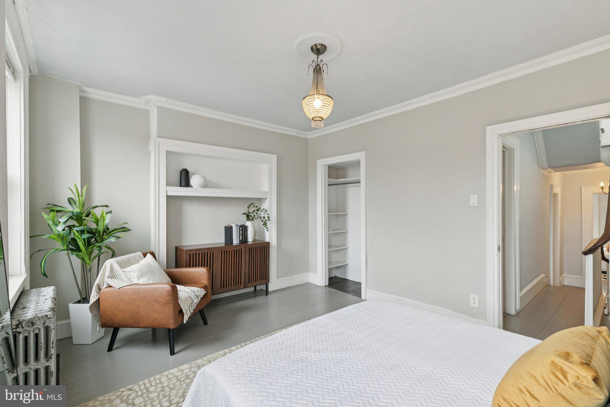 1228 Catharine Street Philadelphia, PA 19147 - Photo 30 of 48 a bedroom with bed and a couch