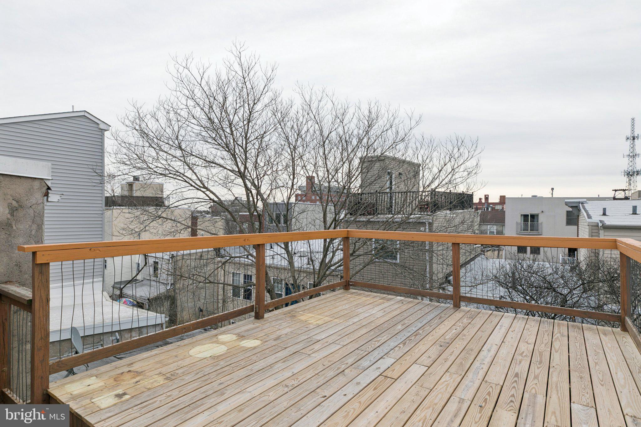 1228 Catharine Street Philadelphia, PA 19147 - Photo 35 of 48 a view of balcony with wooden floor and fence
