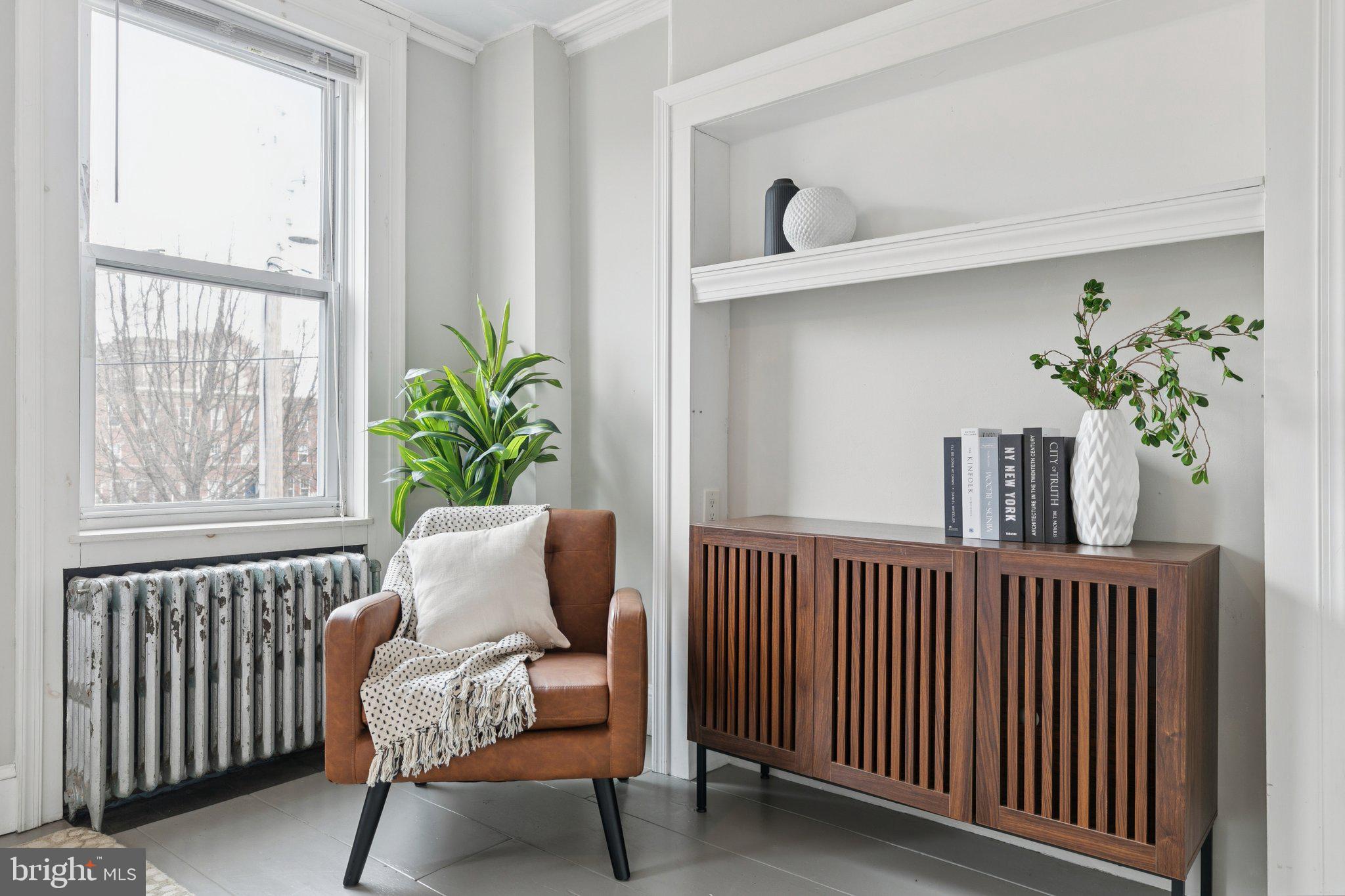 1228 Catharine Street Philadelphia, PA 19147 - Photo 39 of 48 a view of a dining room with furniture and a potted plant