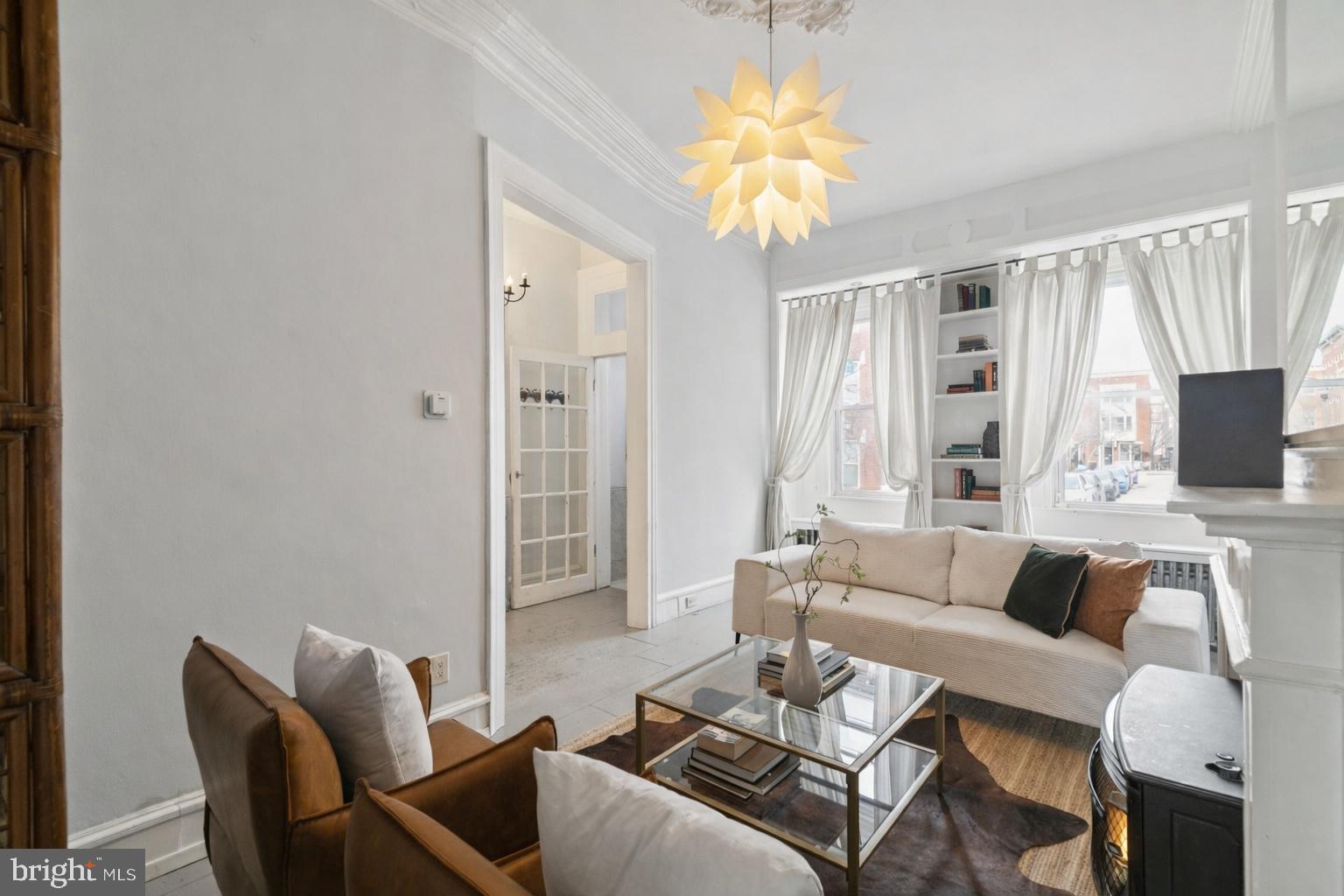 1228 Catharine Street Philadelphia, PA 19147 - Photo 7 of 48 a living room with furniture and a flat screen tv