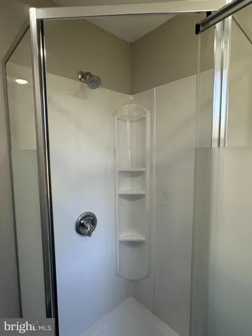 a bathroom with a shower and toilet