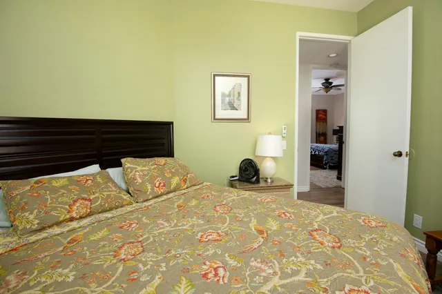 a bedroom with a bed and a view of bathroom