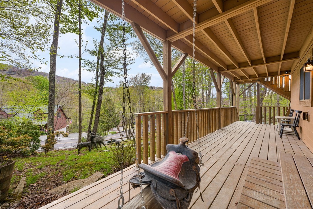 259 Greenbriar Road Beech Mountain, NC 28604 - Photo 30 of 41 a view of balcony with couch and wooden floor