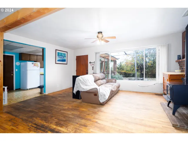 a spacious bedroom with a bed and a large window