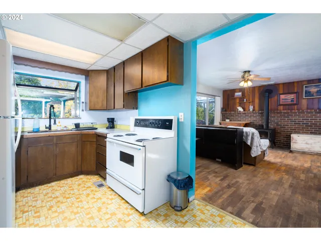 a kitchen with a stove and a microwave