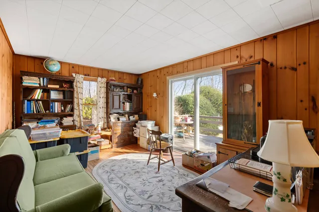 a living room with furniture and large window
