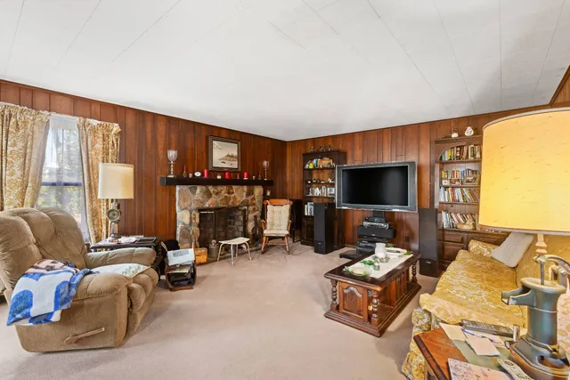 a bedroom with furniture and a flat screen tv