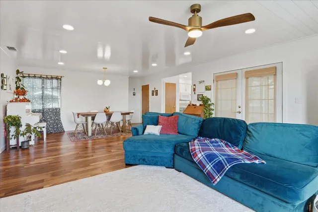 a view of a dining room with furniture and wooden floor