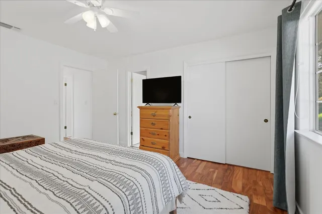 a bathroom with a sink vanity and a mirror