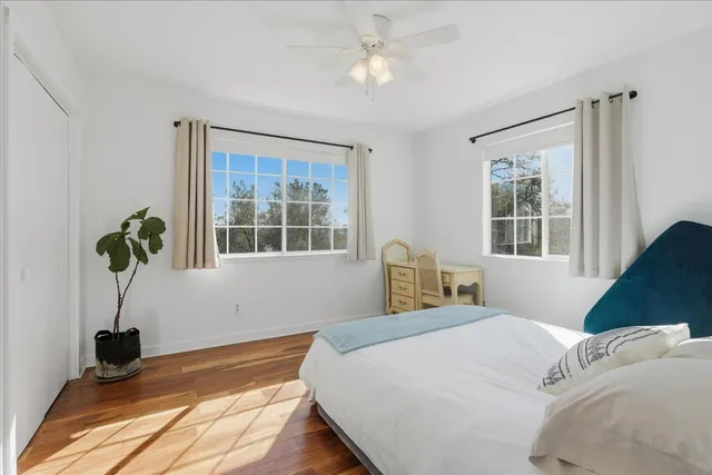 a bedroom with a bed and a mirror