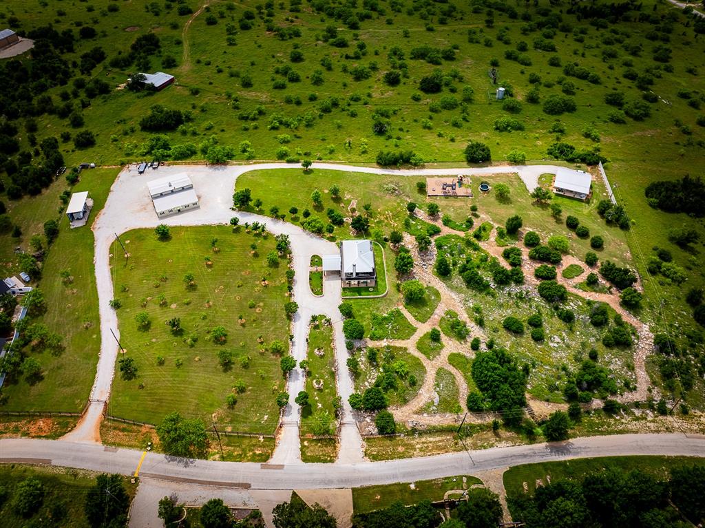 7060 Hells Gate Loop Strawn, TX 76475 - Photo 38 of 40 a view of a swimming pool with a yard