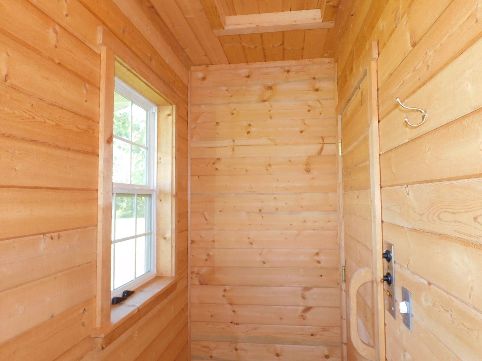 9480 State Highway 13 South Range, WI 54874 - Photo 45 of 51 Doorway to outside with wooden walls and a sauna / steam room