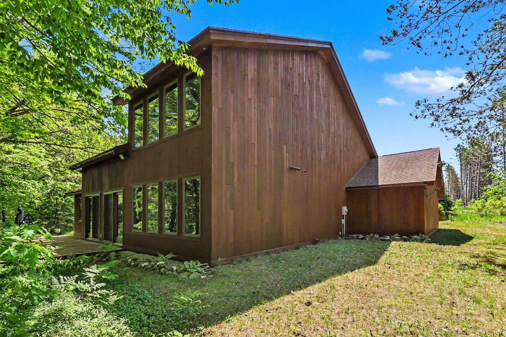 780 East Conrad Road Scottville, MI 49454 - Photo 2 of 34 Lots of windows to enjoy the outdoors