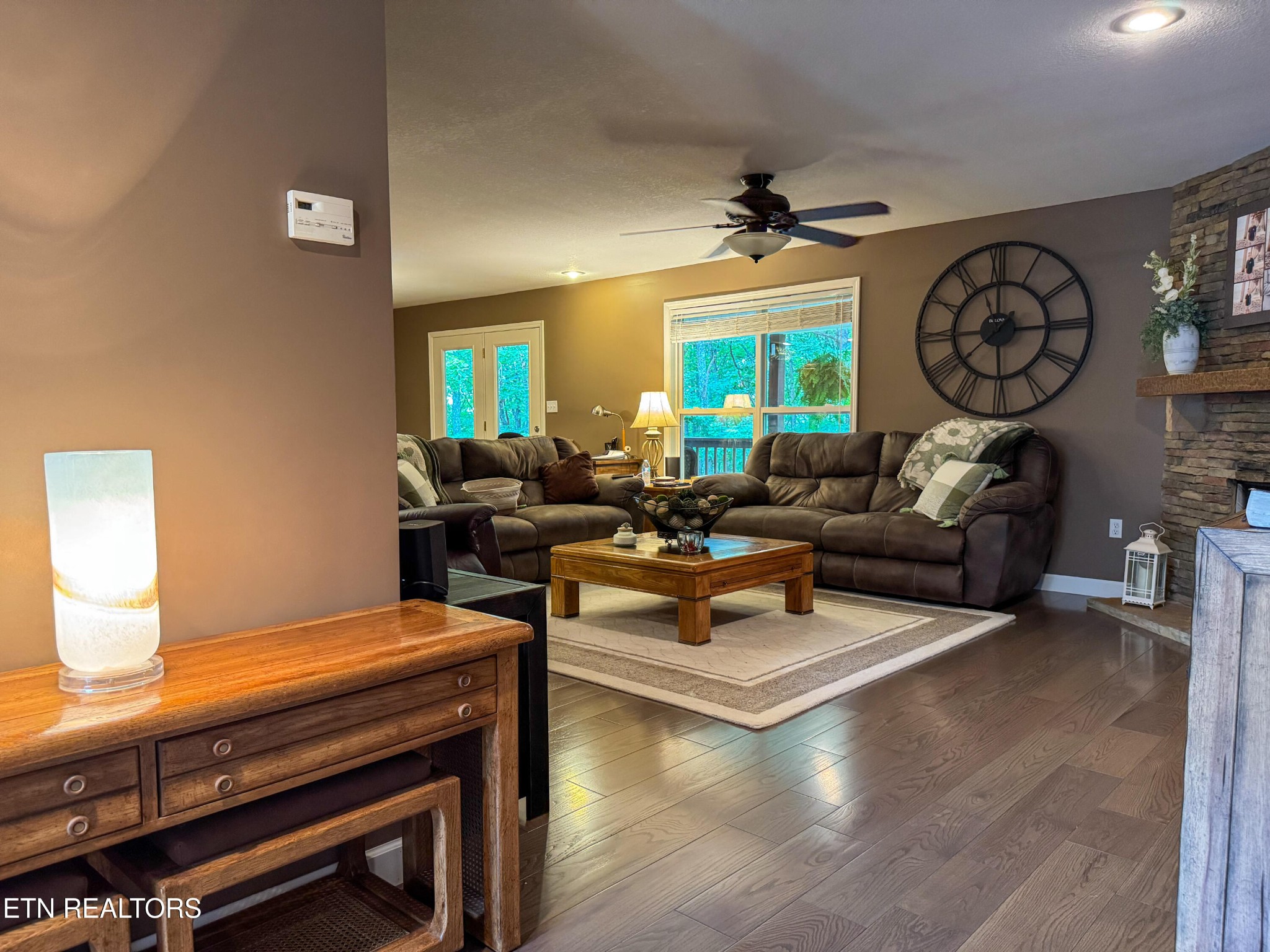 160 Brady Lane Oneida, TN 37841 - Photo 17 of 43 a living room with furniture a clock on wall and a window
