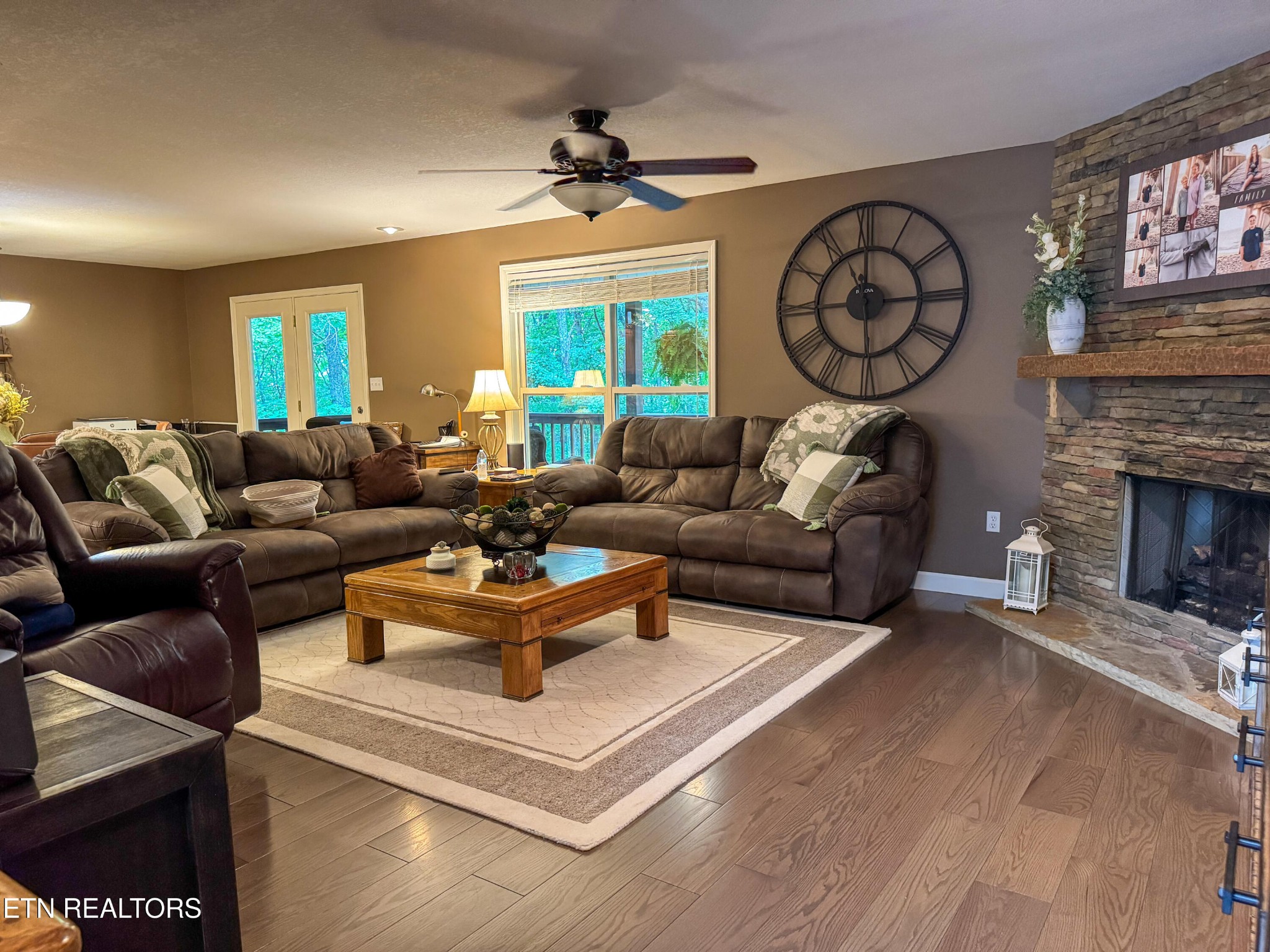160 Brady Lane Oneida, TN 37841 - Photo 18 of 43 a living room with furniture a clock on wall and a fireplace