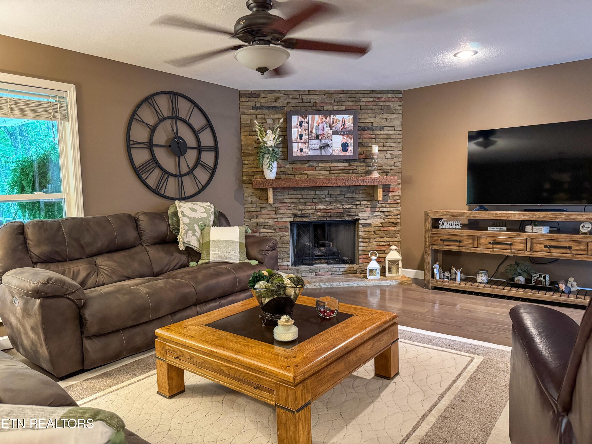 160 Brady Lane Oneida, TN 37841 - Photo 19 of 43 a living room with furniture a flat screen tv and a fireplace