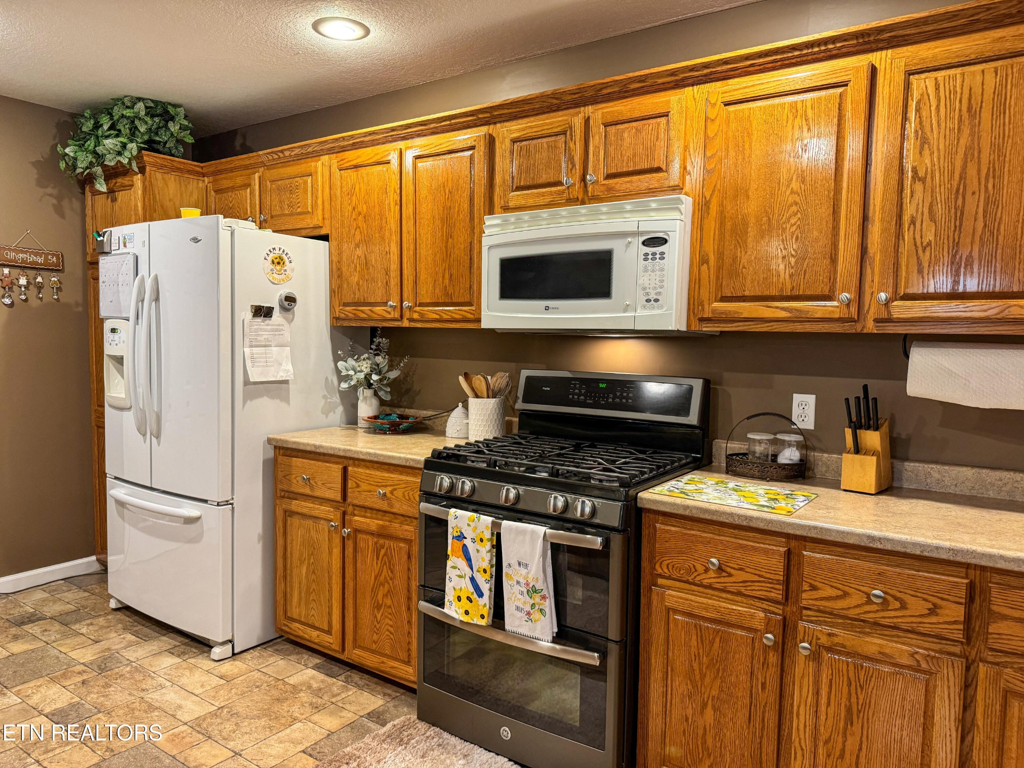 160 Brady Lane Oneida, TN 37841 - Photo 27 of 43 a kitchen with stainless steel appliances granite countertop a refrigerator a stove and a sink