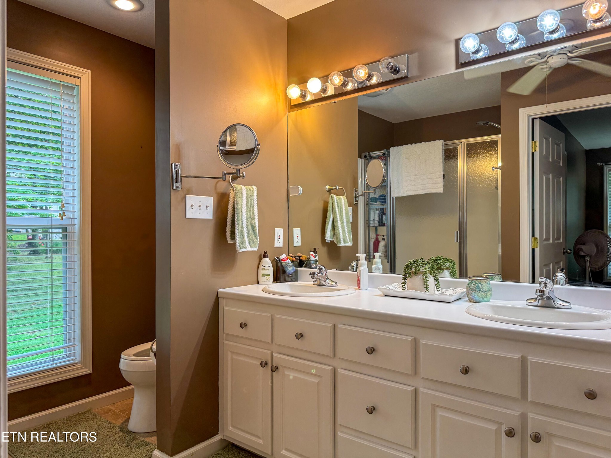 160 Brady Lane Oneida, TN 37841 - Photo 31 of 43 a bathroom with a double vanity sink and a mirror
