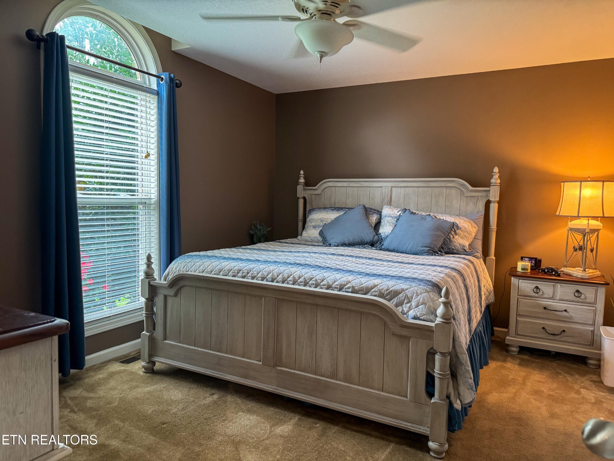 160 Brady Lane Oneida, TN 37841 - Photo 34 of 43 a bedroom with a bed and a chandelier
