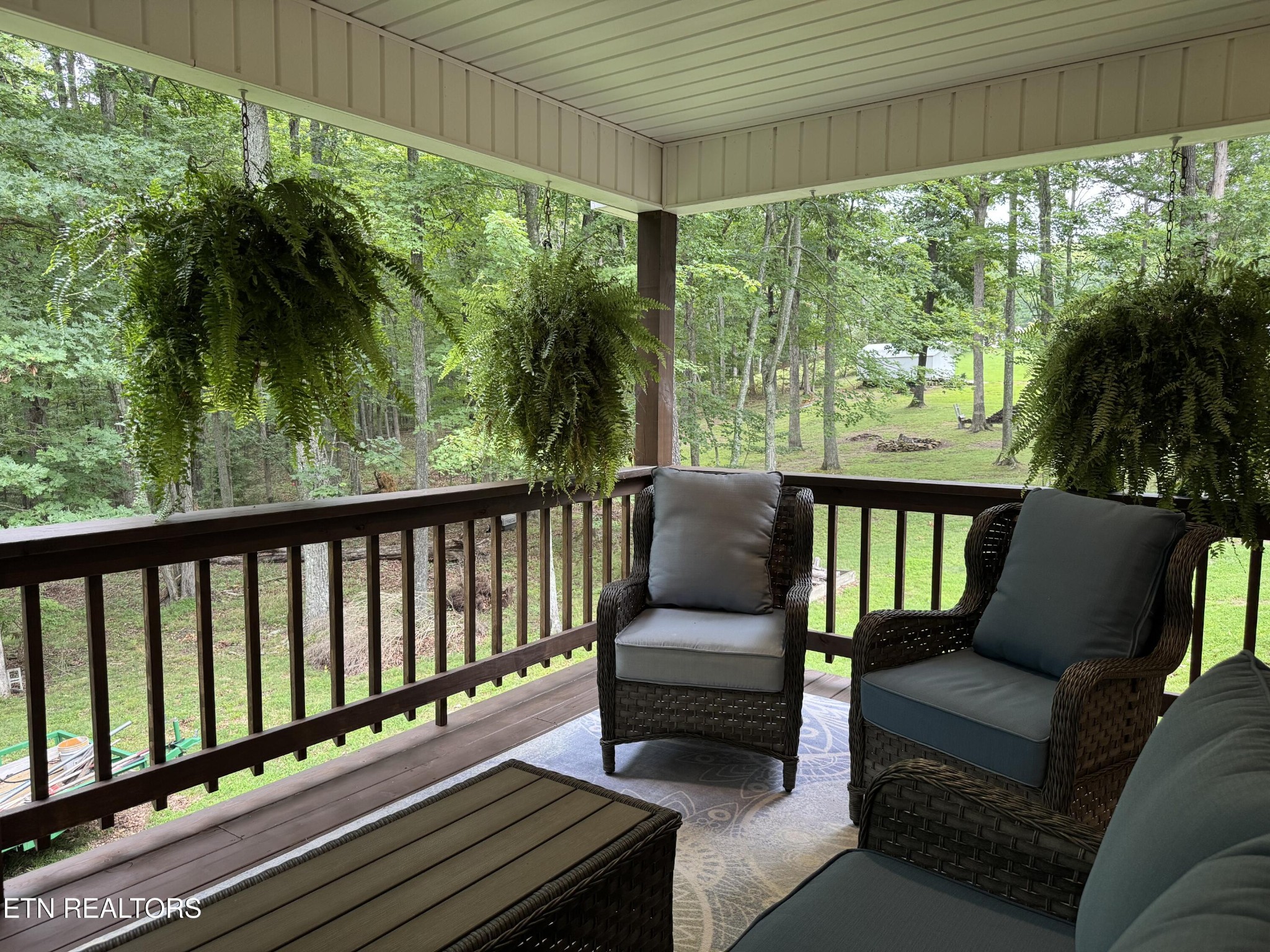 160 Brady Lane Oneida, TN 37841 - Photo 37 of 43 a balcony with wooden floor and outdoor seating