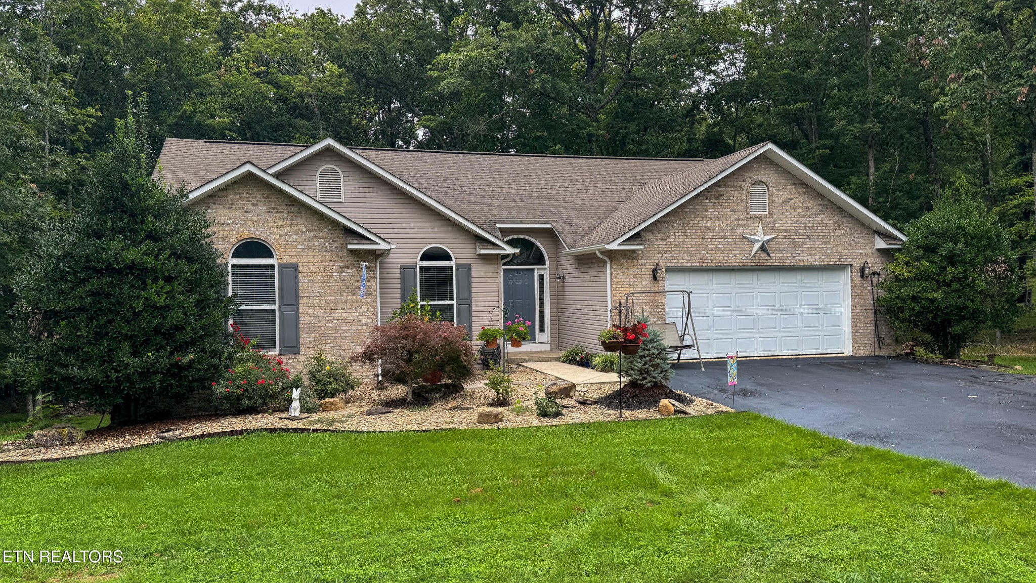 160 Brady Lane Oneida, TN 37841 - Photo 4 of 43 a house view with a garden and backyard