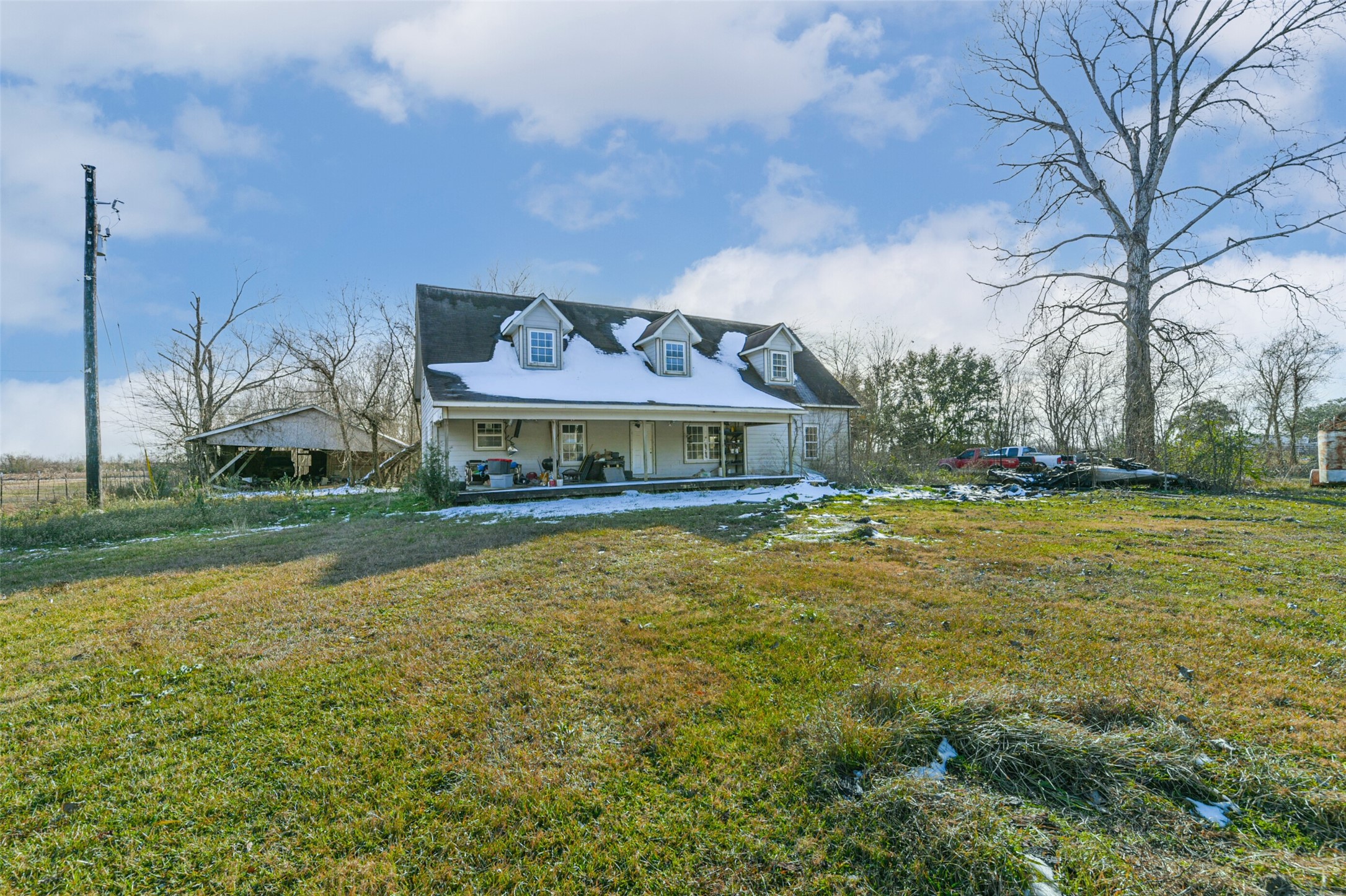 6510 Del Bello Spur Manvel, TX 77578 - Photo 3 of 21 a front view of house with yard and lake view