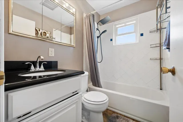 a bathroom with a sink a toilet and a bathtub