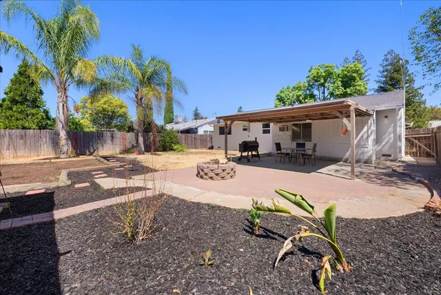 a view of a backyard with a patio