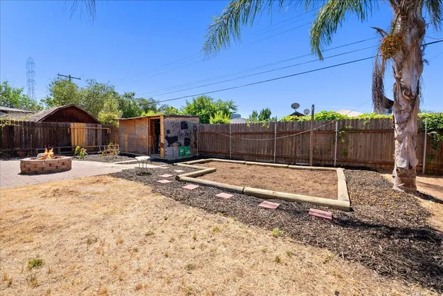 a view of a backyard with a patio