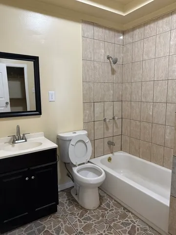 a bathroom with a toilet a sink and bathtub