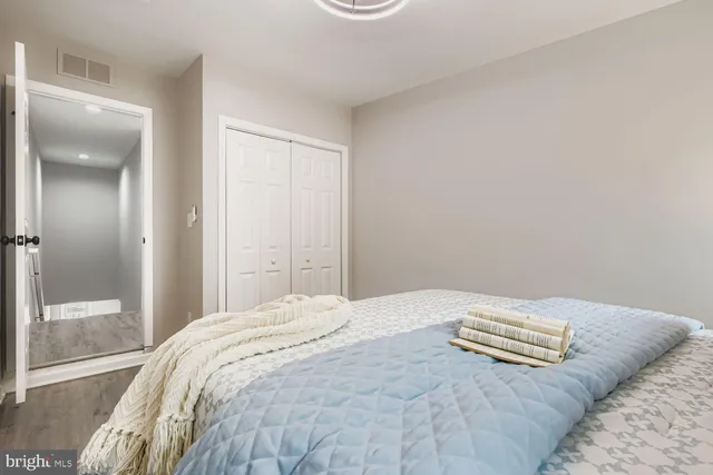 a bedroom with a bed and a shower