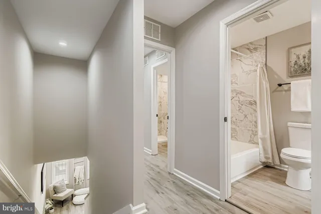 a bathroom with a bathtub and a toilet