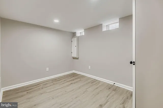 a view of room with wooden floor