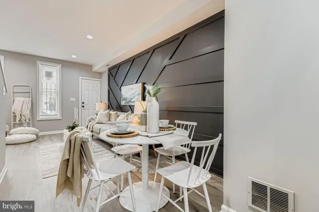 a view of a dining room with furniture and a table